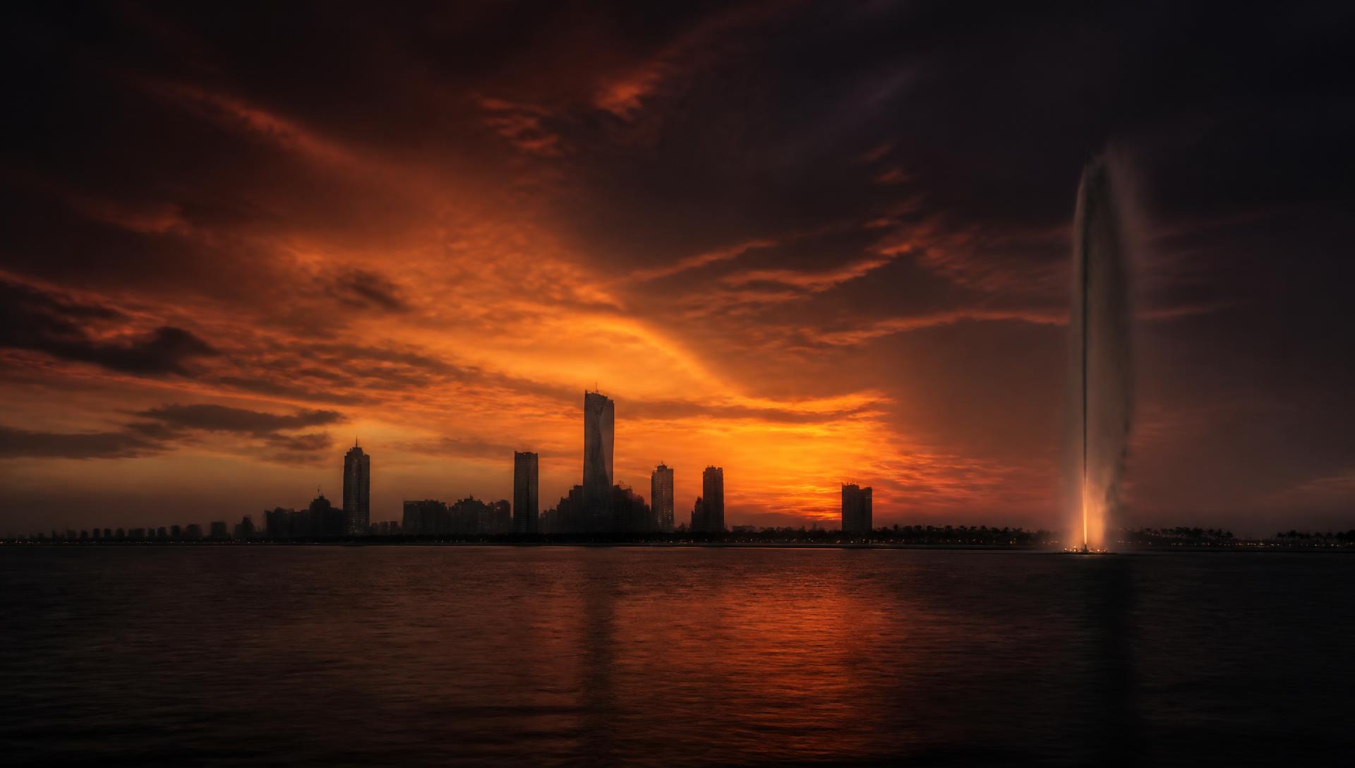 Jeddah skyline at dusk across the Red Sea corniche